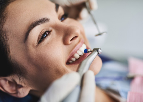 Woman having her teeth cleaned