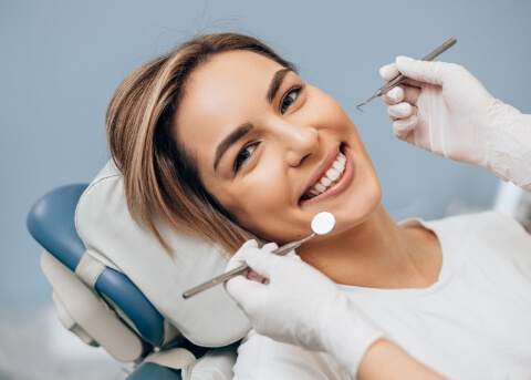 Woman smiling during dental checkup
