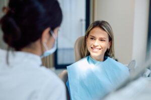 Woman smiling at her dental hygienist